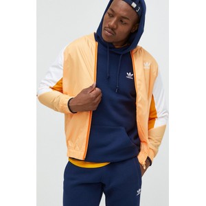 Pomarańczowa kurtka Adidas Originals krótka w sportowym stylu