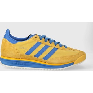 Żółte buty sportowe Adidas Originals w sportowym stylu